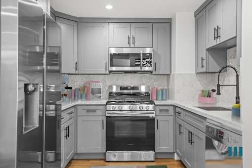 Kitchen with Stainless-Steel Refrigerator, Stove, Microwave Oven, and Dishwasher