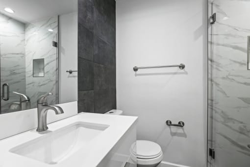 Bathroom with a Stand-Up Shower and Vanity Cabinet Storage