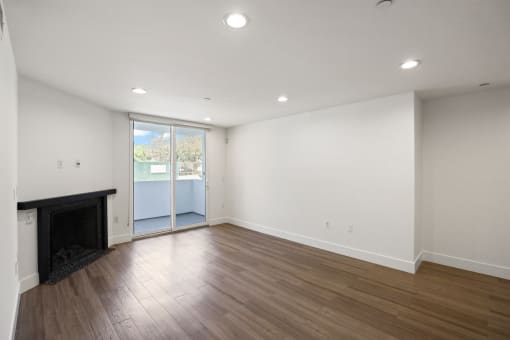 Living Room with Electric Fireplace, Recessed Lighting, Vinyl Flooring, and Patio