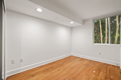 Bedroom with Recessed Lighting, Vinyl Flooring, and Windows