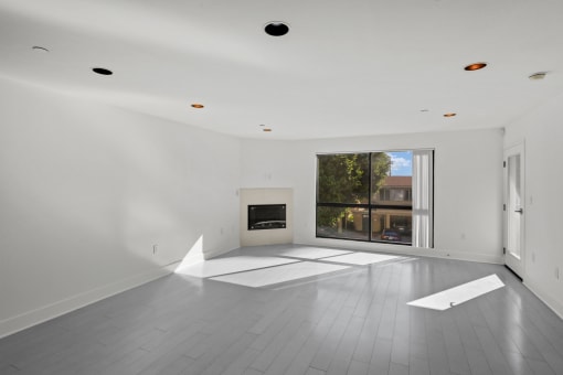 Large-Size Living Room with Electric Fireplace, Patio, and Windows