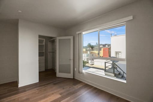 Bedroom with Walk-In Closet with Built-In Organizers