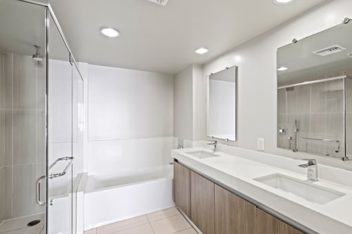 Master Bathroom with Double-Sink Vanity, Full-Size Bathtub, and a Walk-In Shower
