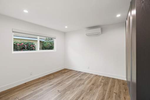 Bedroom with Reccessed Lighting, Closet Storage, and Window