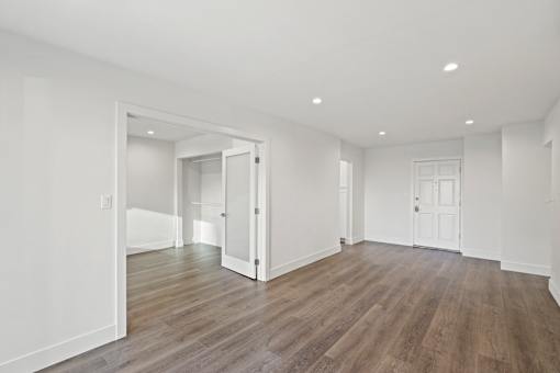 Spacious Living Area with Open-Concept Floor Plan and Vinyl Flooring