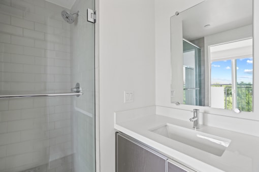Bathroom with Stand-Up Shower with Glass Door and Vanity Cabinet Storage