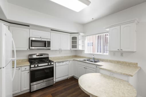Kitchen with Energy-Efficient Stove and Microwave Oven