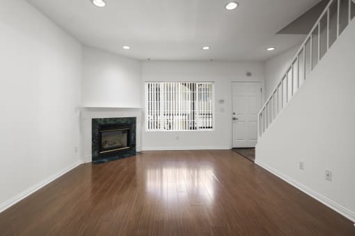 Living Room with Electric Fireplace, Recessed Lighting, Vinyl Flooring, and Patio