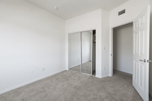 Bedroom with Mirrored Closet