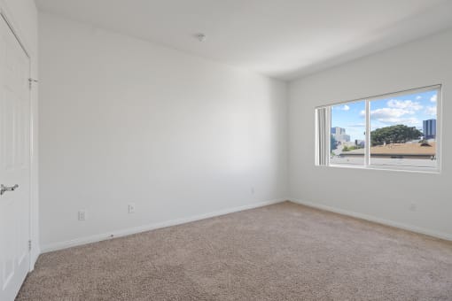 Bedroom with Closet and Large Windows