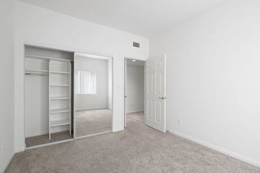 Bedroom with Closet with Built-In Shelving