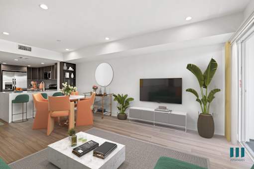 Kitchen with Countertop Bar, Dining Room, and Living Room