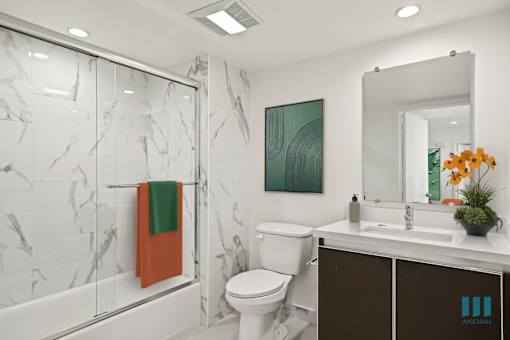 Bathroom with Shower-Bath with a Glass Door and Vanity Cabinet Storage