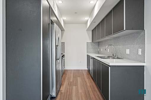 Kitchen with Stainless-Steel Refrigerator, Stove, Dishwasher, and Microwave Oven