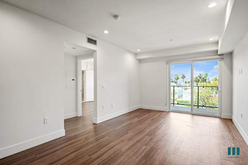 Living Room Area with Vinyl Flooring, Recessed Lighting, and a Patio