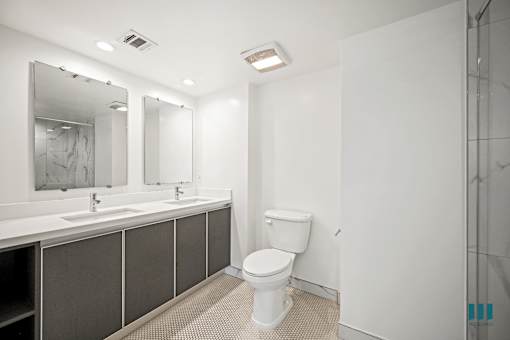 Bathroom with Walk-In Shower, Double-Sink, and Vanity Cabinet Storage