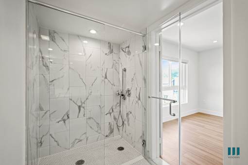 Bathroom with Large-Size Shower with a Glass Door