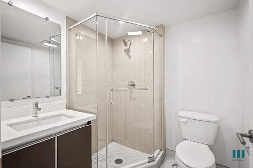 Bathroom with Walk-In Shower and Vanity Cabinet Storage