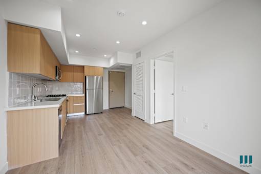 Kitchen with Wooden Cabinets at Venice Wave by Wiseman, California