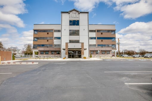 a large building with a parking lot in front of it