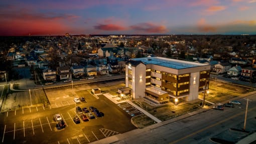 an aerial view of a building in a city at night