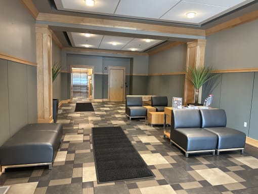 a seating area with couches and chairs