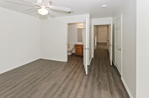 Spacious bedroom with attached bathroom at Cypress View Villas Apartments in Weatherford, TX
