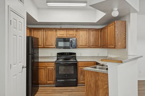 Kitchen with cabinets at Cypress View Villa Apartments in Weatherford TX