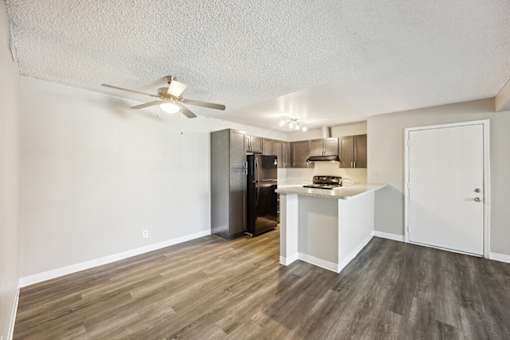 Vacant Dining Room and Kitchen at Woodcreek Apartments in Las Vegas NV