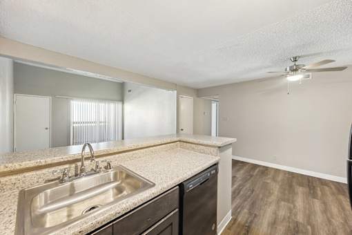 Vacant Kitchen and Dining Room at Woodcreek Apartments in Las Vegas NV