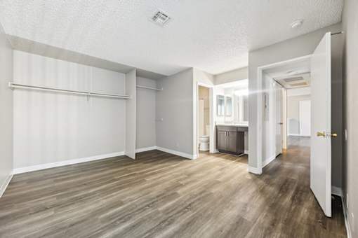 Vacant Primary Bedroom and Bathroom at Woodcreek Apartments in Las Vegas NV