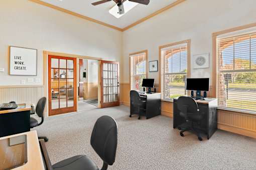 A room with a sign that says "Live Work Create" on the wall.