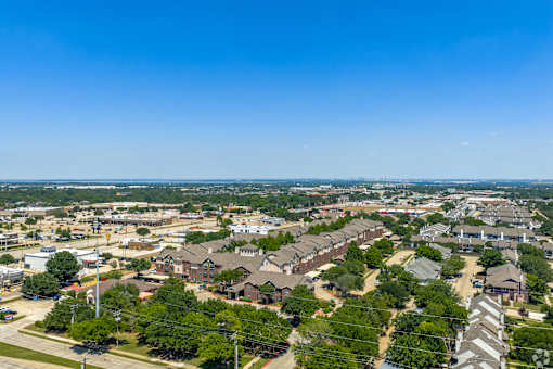 A suburban area with houses and trees.