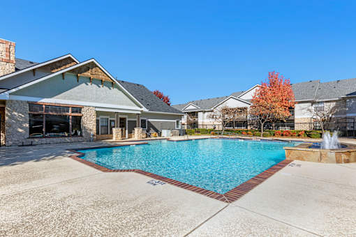 A large swimming pool in the middle of a residential area.