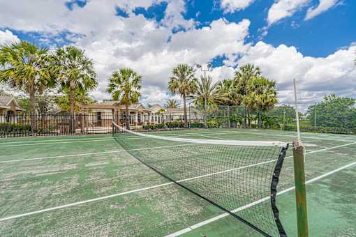 A tennis court with a net in the middle of it.
