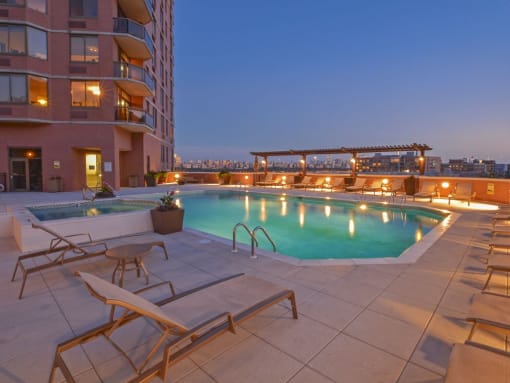 Pool View In Night at Riello Apartments Owner LLC, Edgewater, NJ, 07020