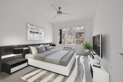 Bedroom With Ceiling Fan at Infinity Edgewater, Edgewater