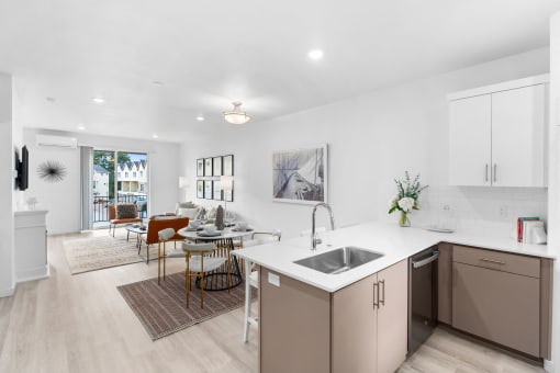a living room with a kitchen and a dining room