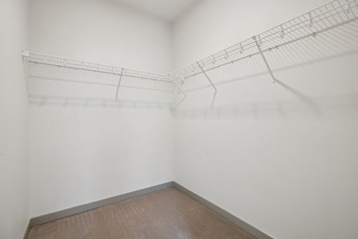 Empty room with a shelf on the wall.