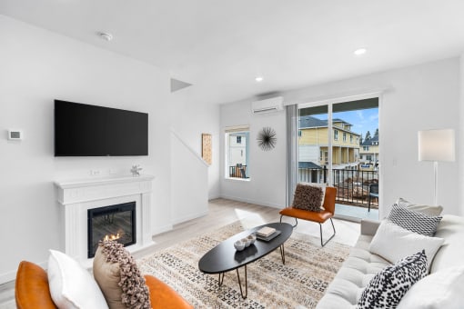 a living room with a couch and a fireplace and a tv