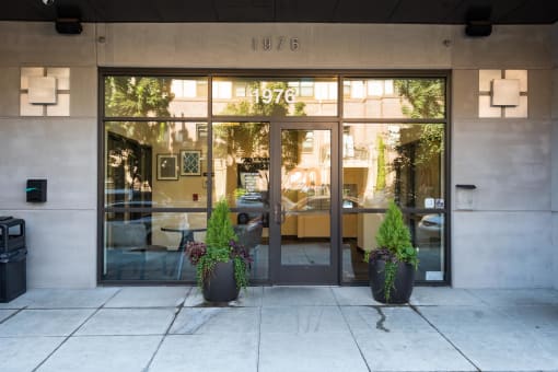 the entrance of a building with glass doors