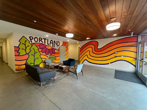 A brightly colored mural with the word "Portland" written on it.