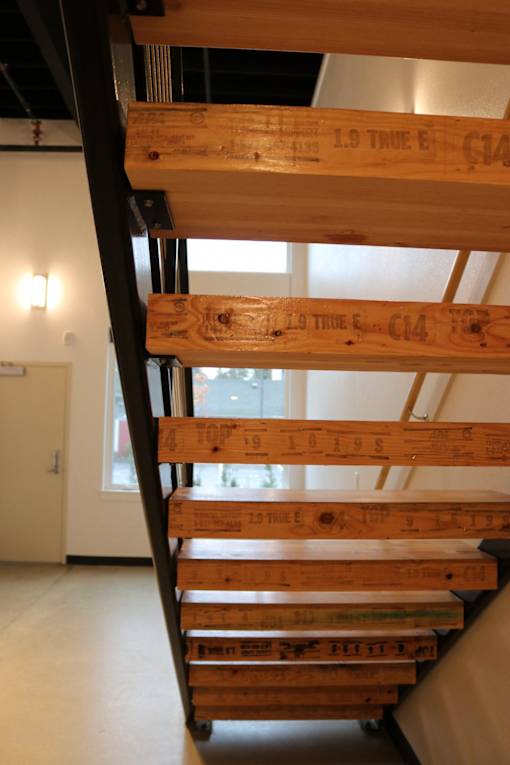 A wooden staircase with the words