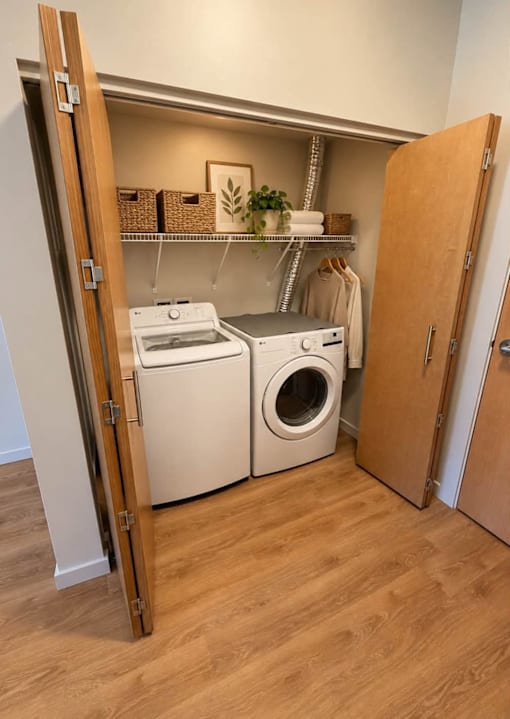 A laundry room with a washer and dryer in it.