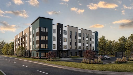 A modern apartment building with the number 700 on the side.