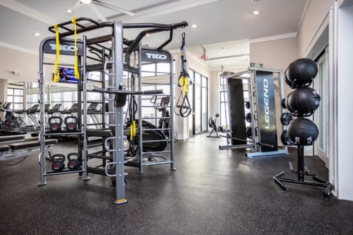 the gym with weights and other equipment at the flats