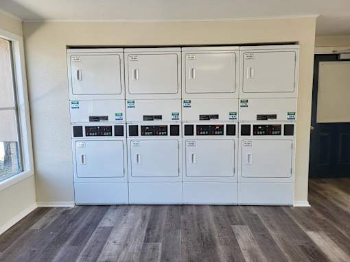 A wall of white electrical panels with blue labels.