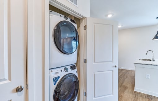 an empty laundry room with a washer and dryer