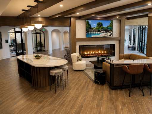 A modern living room with a fireplace and a television.