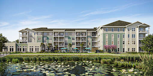A large building with a pond in front of it.